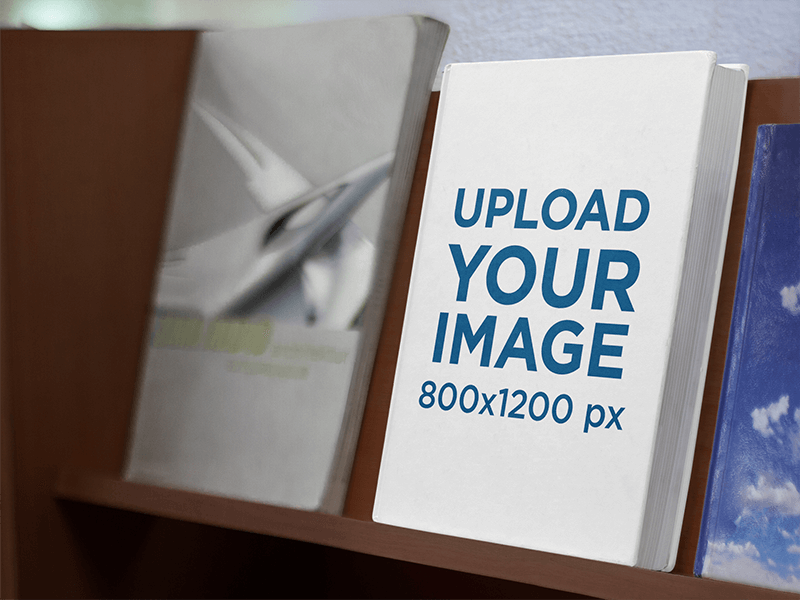 Mockup Of A Hard Cover Book On A Wooden Bookshelf