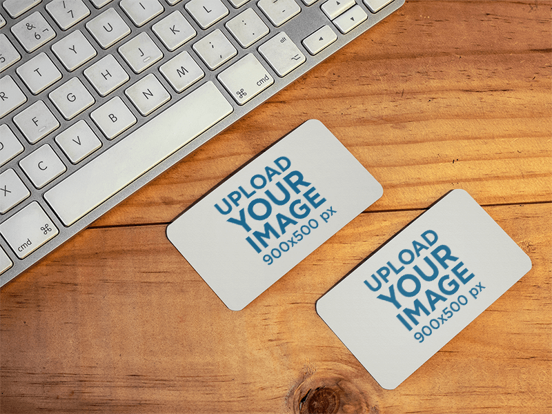 Mockup Of Two Business Cards Lying On Top Of A Desk At An Office