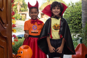 T Shirt Mockup Of Two Kids Trick Or Treating In Halloween