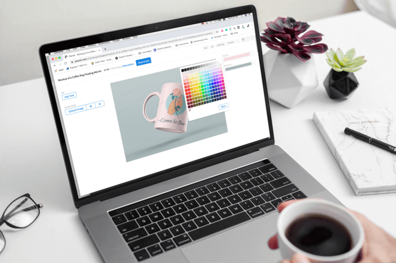 Macbook Pro Mockup On A White Desk Featuring Mug Design