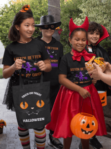 Halloween Mockup Of Kids With T Shirts And Tote Bags Asking For Trick Or Treat