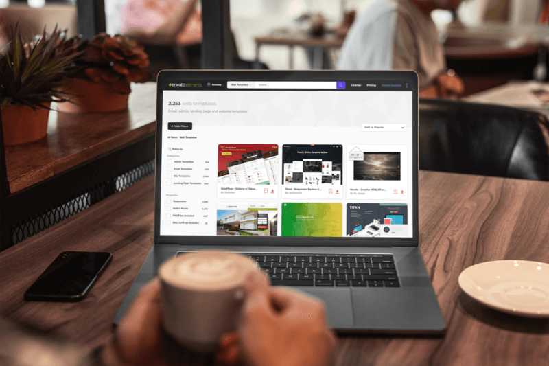 Macbook Pro Mockup Featuring A Man Working At A Coffee Shop