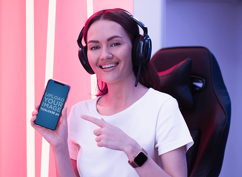 Mockup Featuring A Female Gamer Pointing At Her Iphone
