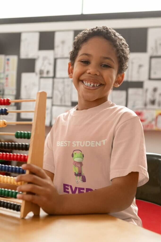 T Shirt Mockup Of A Happy Kid Holding An Abacus 40504 R El2 Easy Resize.com