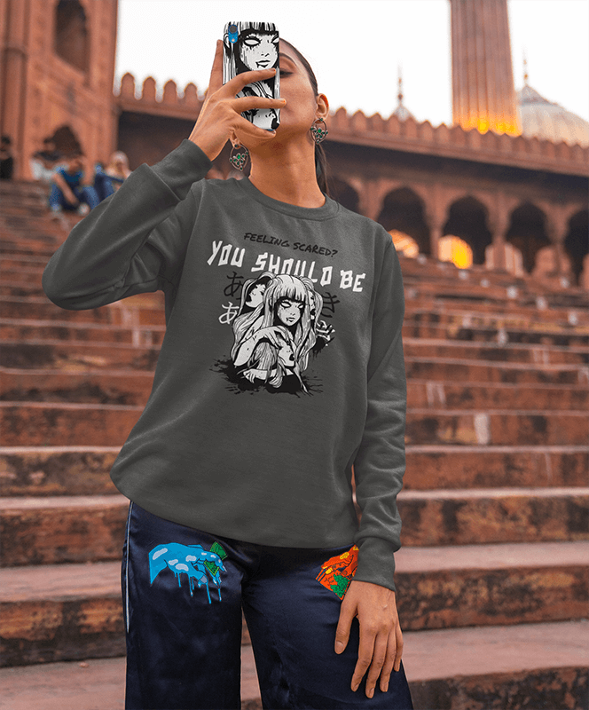 Phone Case Mockup Of A Woman In A Sweatshirt Taking A Picture With Her Smartphone
