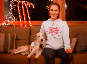 Hoodie Mockup Of A Woman Surrounded By Xmas Ornaments With Her Dog