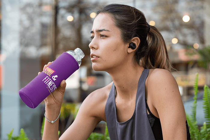 Mockup Of A Fit Woman Drinking From A Bottle In A Koozie