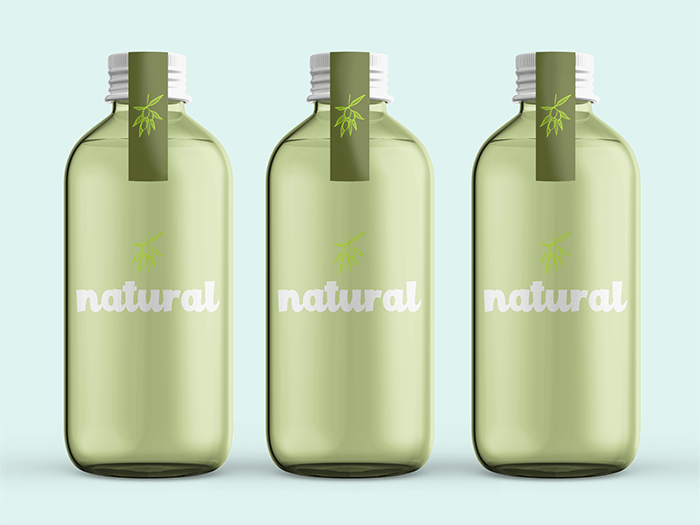 Mockup Of Three Glass Water Bottles In A Plain Setting