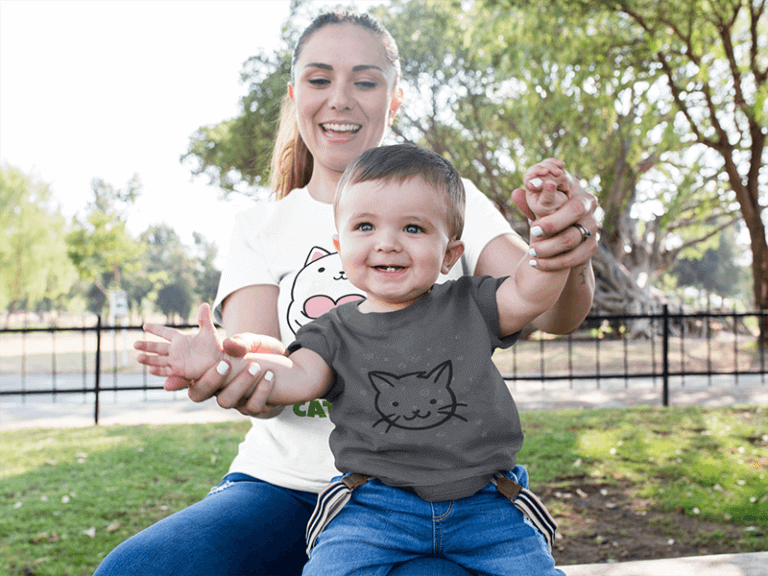 Mom And Her Baby Boy Playing In The Park While Wearing Different Round Neck Tees Mockup 16100 768x576
