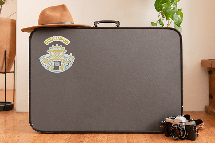 Sticker Mockup Featuring A Suitcase And Other Items