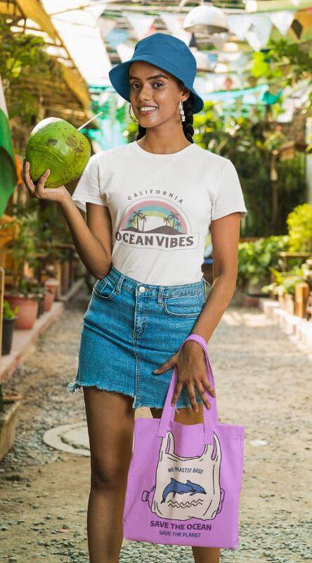 Gildan T Shirt And Tote Bag Mockup Of A Smiling Woman With A Coconut