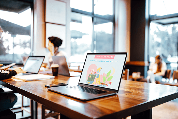 Mockup Of A Macbook Pro On A Table At A Coffee Shop