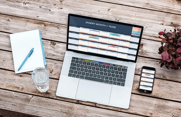 Mockup Of A 15 Inch Macbook Pro And An Iphone Over A Wooden Table