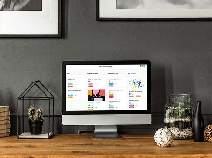 Mockup Of An Imac Placed On A Wooden Desk By Indoor Plants