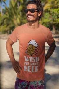 A Summer T Shirt Mockup Of A Smiling Man With Sunglasses By The Beach