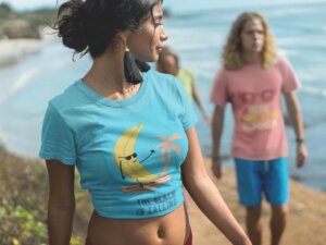 Woman Walking With Her Friends Wearing A Summer T Shirts Mockup At The Beach