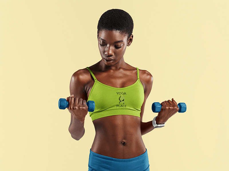 Mockup Of A Woman Wearing A Customizable Sports Bra And Holding Two Dumbbells