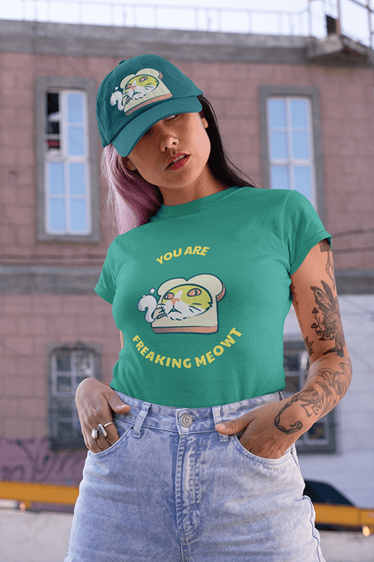 Tee Mockup Of A Woman With A Tattooed Arm Wearing A Dad Hat On The Street