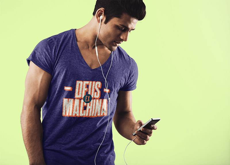 V Neck T Shirt Mockup Of A Man With His Phone In A Studio