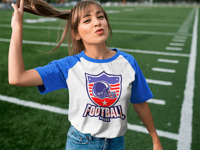 Flirty Young Girl Wearing A Raglan Tee At A Football Field