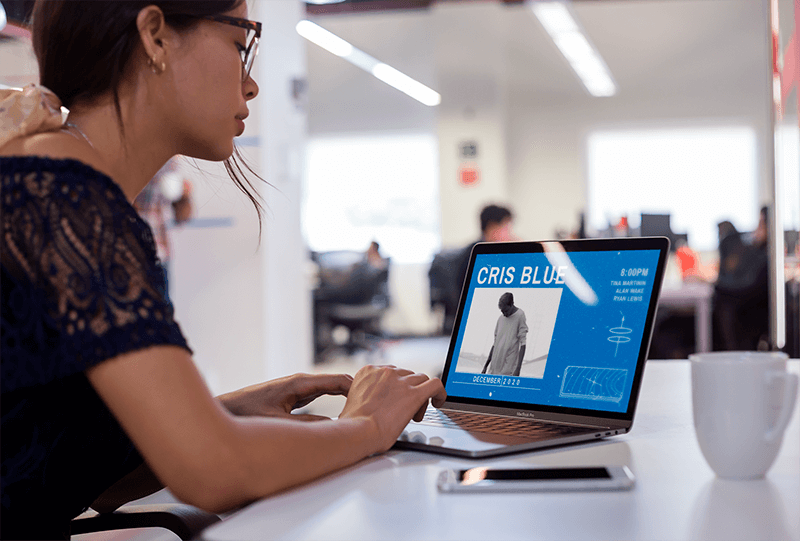 Mockup Of A Girl Working On Her Macbook At A Modern Office