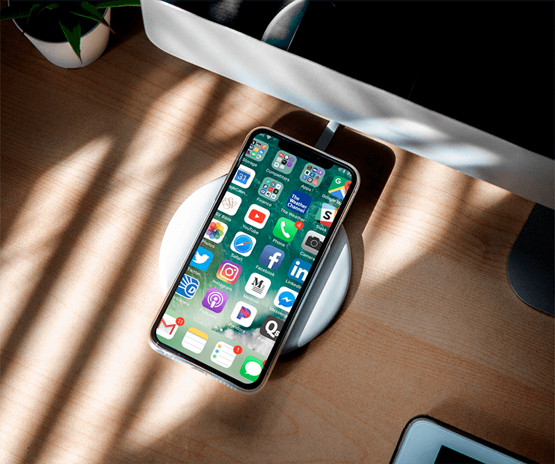 Mockup Of An Iphone 11 Pro Featuring A Wireless Charger