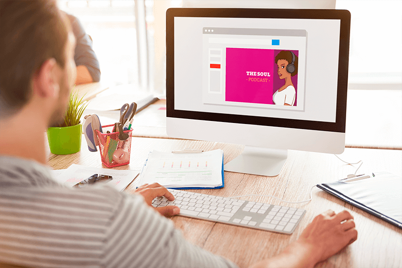 Over The Shoulder View Mockup Of A Man Using An Imac