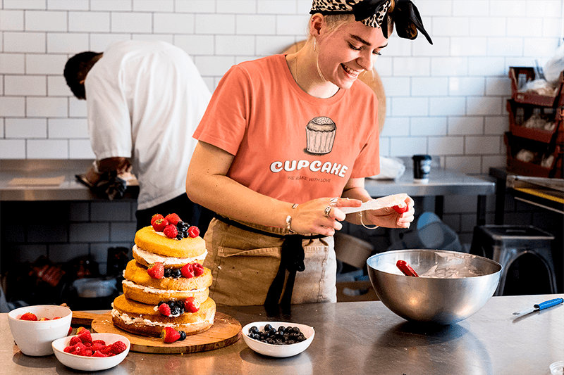 T Shirt Mockup Of A Baker Decorating A Cake