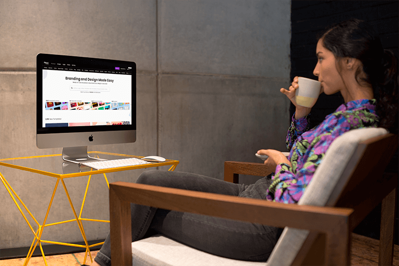 Woman Sipping Tea In Front Of An Imac Mockup