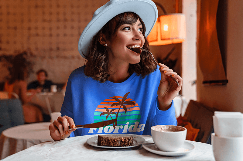 Sweatshirt Mockup Of A Woman Eating A Cake At A Coffee Store