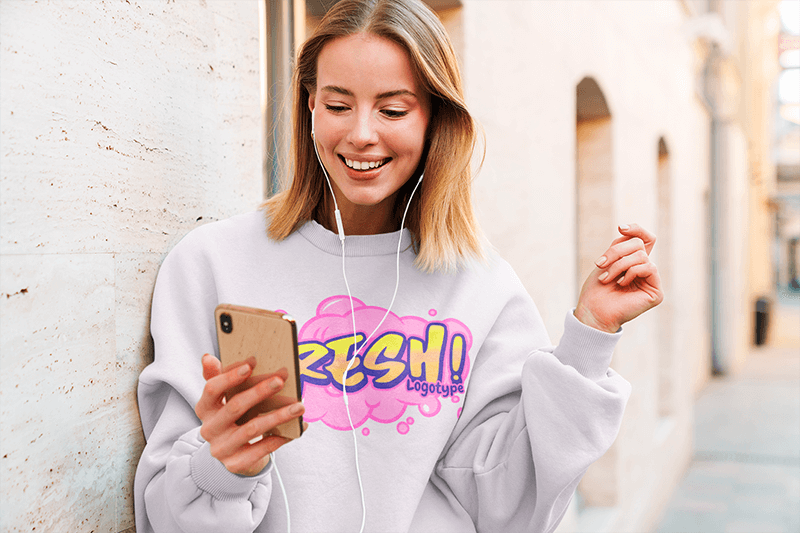 Sweatshirt Mockup Of A Young Woman Listening To Music On The Street