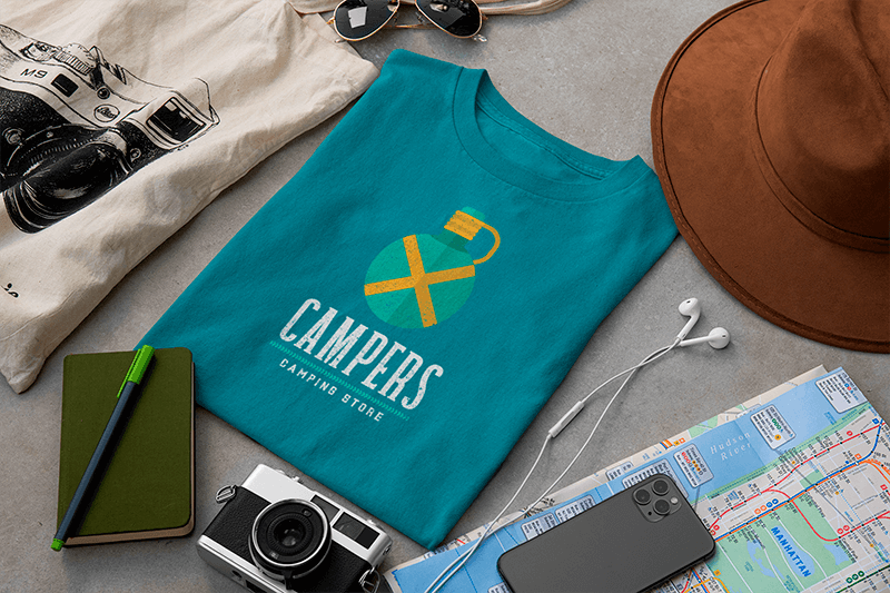 T Shirt Mockup Surrounded By Travel Accessories