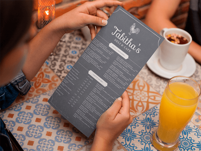 Young Girl Reading A Vertical Restaurant Menu Mockup