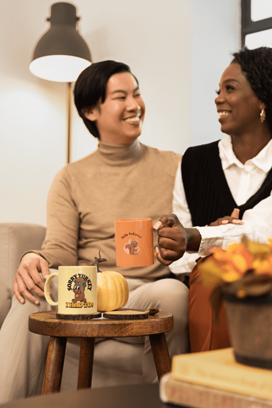 11 Oz Coffee Mug Mockup Featuring Two Friends Enjoying Thanksgiving