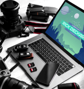 Mockup Featuring A Macbook Pro Surrounded By Photography Equipment