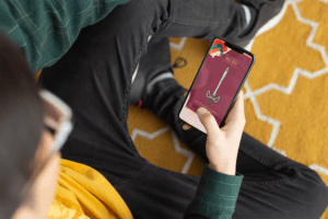 Iphone X Mockup Featuring A Man Sitting On A Rug