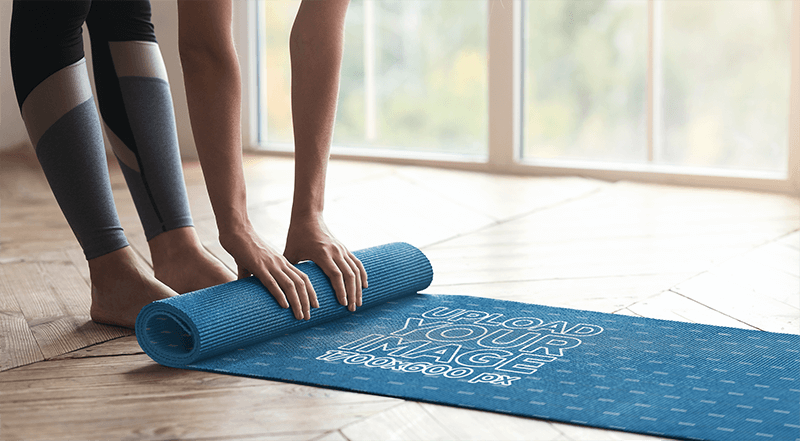 Mockup Of A Woman Rolling Up A Yoga Mat