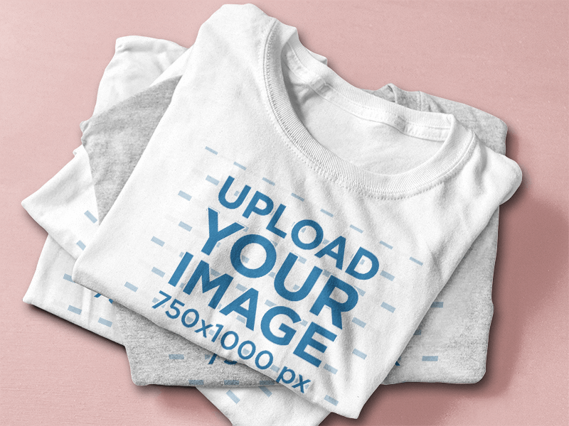 T Shirt Mockup Featuring A Stack Of Folded T Shirts