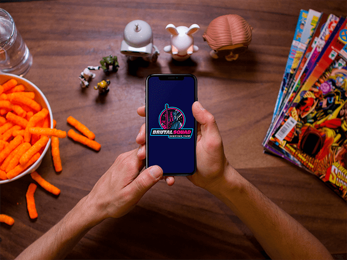 Man Gaming With Iphone X Mockup While On His Table