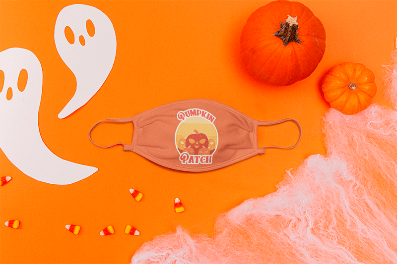 Mockup Of A Face Mask Placed Between Some Halloween Ornaments