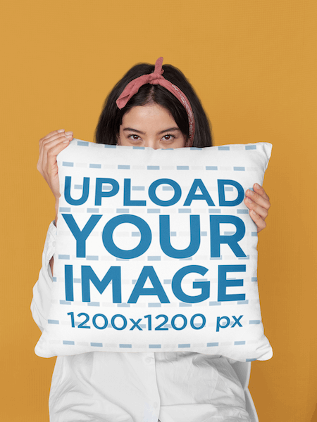 Mockup Of A Woman Covering Her Face With A Pillow At A Studio