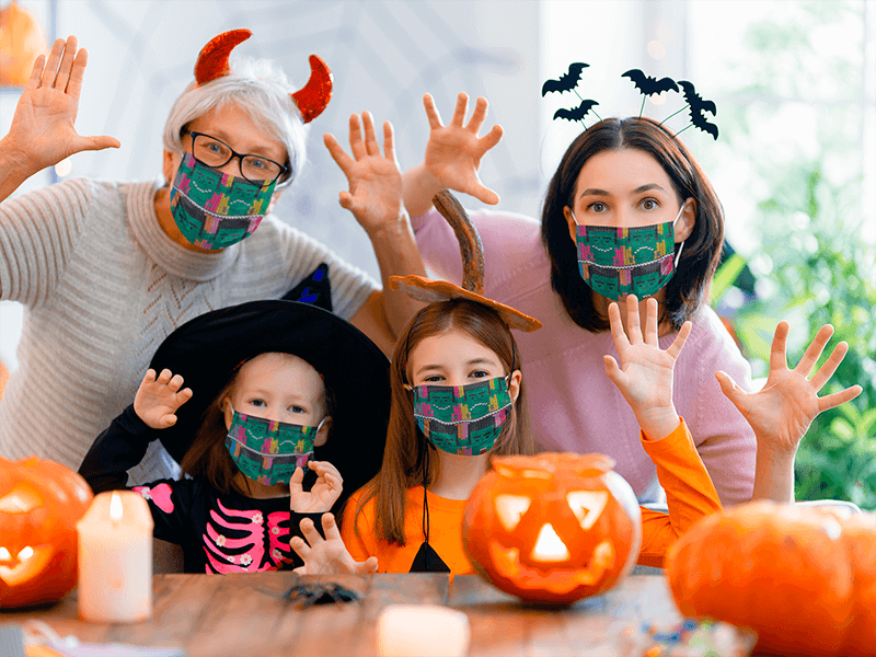 Face Mask Mockup Of A Family Celebrating Halloween