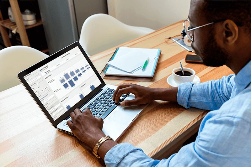 Macbook Pro Mockup Of A Man Working From Home