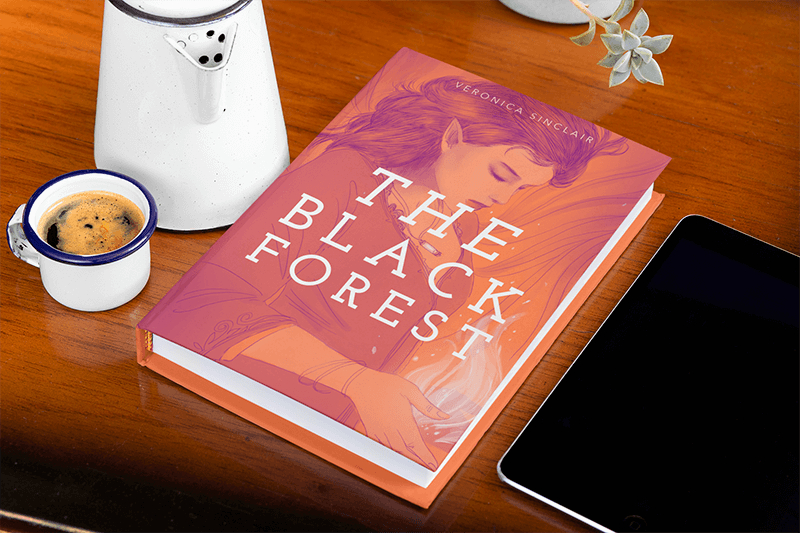 Mockup Featuring A Hardcover Book Placed On A Wooden Table