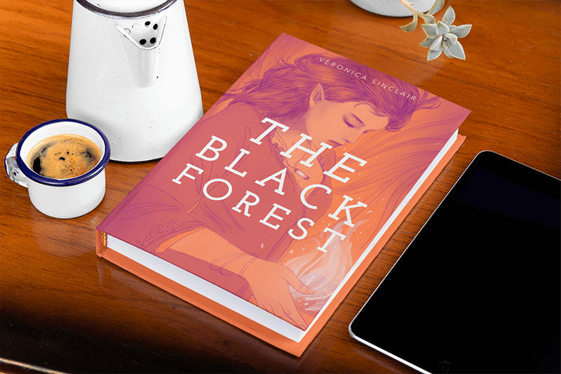 Mockup Featuring A Hardcover Book Placed On A Wooden Table 