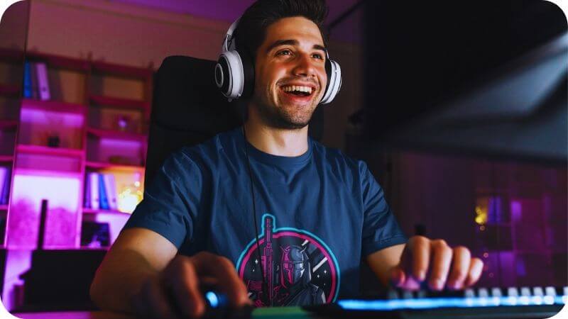 gamer happy playing games and adding extra features to his Twitch profile