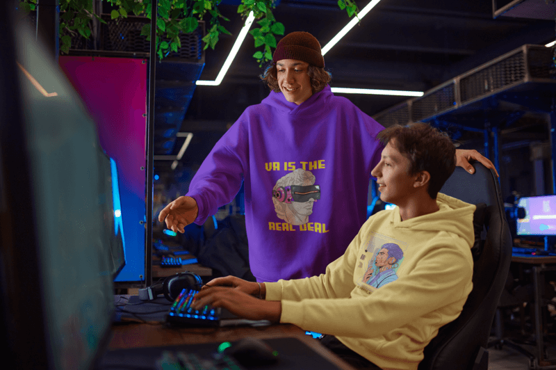 Hoodie Mockup Featuring Two Teenagers Playing Videogames At A Gaming Center M10859 R El2