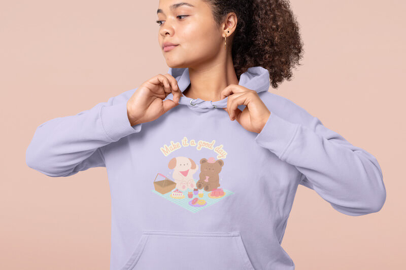 Hoodie Mockup Featuring A Woman Posing Against A Solid Background