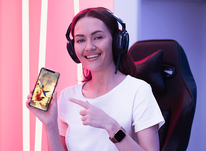 Mockup Featuring A Female Gamer Pointing At Her Iphone