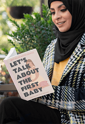 Mockup Of A Woman In A Hijab Holding A Paperback Book